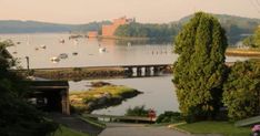 there is a view of the water and boats in the harbor from this house on the other side