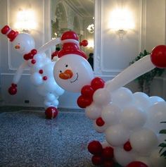 balloon snowmen are lined up in the hallway