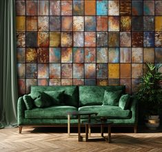 a green couch sitting in front of a wall covered in lots of different colored tiles