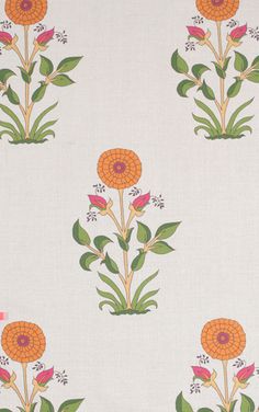 an orange flower on white fabric with green leaves and flowers in the center, as well as two smaller pink flowers