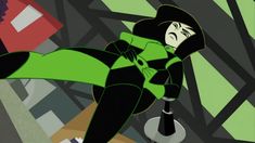 an animated image of a woman in green and black