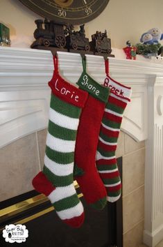 two christmas stockings hanging from a mantel