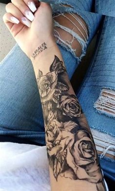 a woman's arm with flowers on it