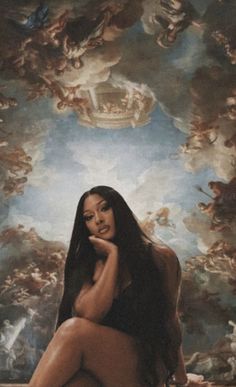 a naked woman sitting on the ground in front of a ceiling with clouds above her