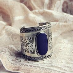 A gorgeous lapis toned stone adorns this bohemian bracelet. Designed on an antiqued silver base, this cuff bracelet has intricate inlaid details. The perfect bohemian winter addition for your collection. Color: Silver & lapis Width: 2 3/4" Winter Addition, Bohemian Winter, Boho Turquoise, Trendy Watches, Bohemian Bracelets, Party Earrings, Turquoise Rings, Bohemian Jewelry, Silver Bracelets