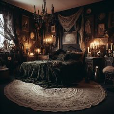 an old fashioned bedroom with candles and pictures on the wall, rugs and bedding