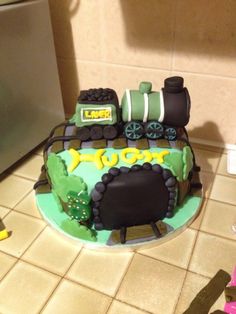 a cake shaped like a train on top of a table