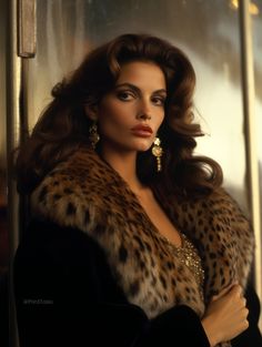 a woman with long hair wearing a leopard print coat and gold earrings, posing in front of a mirror