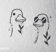 two ducks are drawn on paper with black ink