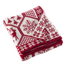 two red and white knitted blankets with snowflakes on the bottom, one is folded