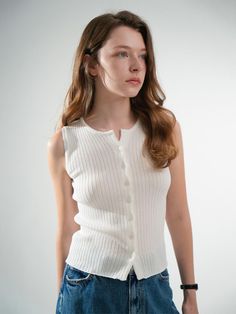 This is a casual and trendy top by VLETI that is made out of high quality and sturdy material. With distinctive mood of the design and comfortable wear, you can style it for your feminine summer outfit.- Round neckline and sleeveless design- Button closure on the front- Trendy and feminine casual mood Trendy Sleeveless Sweater Vest For Day Out, Fitted Sweater Vest For Day Out, Ribbed Sleeveless Sweater Vest For Summer, Fitted Summer Sweater Vest For Day Out, Trendy Knit Vest For Summer, Fitted Sweater Vest For Summer Day Out, Trendy Knit Vest For Day Out, Casual Sweater Vest With Buttons, Summer V-neck Ribbed Vest