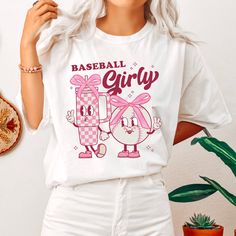 a woman with white hair wearing a baseball girl t - shirt and shorts, standing next to a potted plant