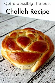 a piece of bread sitting on top of a white wooden table with text overlay that reads, quite possibly the best chalabh recipe