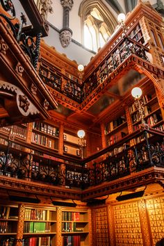 the inside of a library with many bookshelves