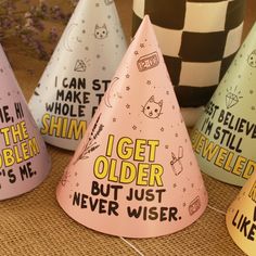 five party hats that say i get older but just never wise