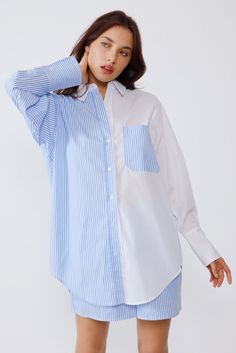 Spice up any look with this delightful Pamela striped color block shirt! Featuring contrast colors, oversized buttons, long sleeves, chest pockets, and a hi-low round hemline, this shirt is the perfect addition to any wardrobe. Plus, the 100% cotton fabric is lightweight and breathable, so you won't feel itchy or uncomfortable. Bring your style game to a whole 'nother level! Oversized Tops With Contrast Color For Spring, White Tops With Contrast Stripes For Layering, Spring Long Sleeve Shirt With Contrast Color, Casual Long Sleeve Shirt With Contrast Color, Blue Long Sleeve Shirt With Contrast Stripes, White Shirt With Contrast Color For Spring, Summer Cotton Blouse With Striped Sleeves, White Color Block Blouse For Work, Casual Cotton Blouse With Striped Sleeves