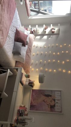 a bedroom with lights on the wall and bed