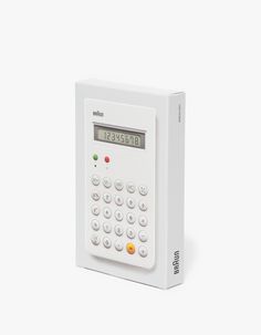 a calculator sitting on top of a white box