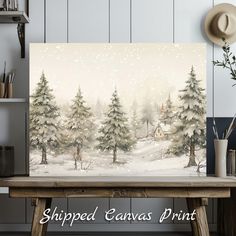 a snowy scene with pine trees and a cabin in the background is featured on this canvas