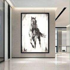 a horse is running in the middle of a room with white walls and flooring