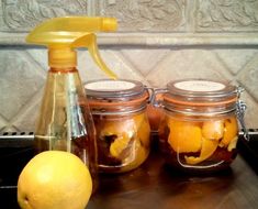 orange peel white vinegarr cleaner for your good and kitchen - fresh lemons on the counter