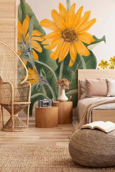 a bedroom with yellow sunflowers painted on the wall and wicker furniture in front