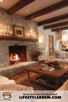 a living room filled with furniture and a fire place next to a stone wall fireplace