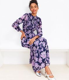 With a smocked top, puffed blouson sleeves, a flowy skirt, and ruffle trim, this dress is flattering, flirty, romantic - basically, it's a total wardrobe dream. Standing collar. Front Henley placket. 3/4 sleeves with button cuffs. Lined.,Fabric:Fabric: Fluid woven,Hit:Hit: Maxi - Hits at ankle,Imported:Imported,Fit:Fit: Waisted - fits and flatters waist,Length:54 1/4" from shoulder to hem, measured from a size 8/M,Fabrication:Shell: 100% Polyester Lining: 100% Polyester Exclusive of elastic,Garment Care:Machine Washable Loft Floral Clip Smocked Tiered Maxi Dress Size 10 Deep Space Blue Women's by Loft Size Regular - 10 Deep Space Blue Women's Fit,  Flare, Dresses, Everyday, Shell:, 100%, Polyester, Lining:, 100%, Polyester, Exclusive, of, elastic, Machine, Washable Dresses Everyday, Flare Dresses, Loft Dress, Smocked Top, Standing Collar, Color Crush, Tiered Maxi Dress, Flowy Skirt, Deep Space