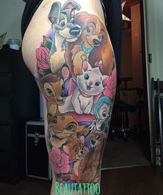 a woman's thigh with many cartoon characters on it