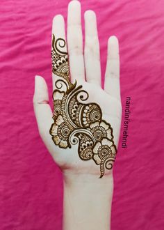 a hand with henna tattoo on it