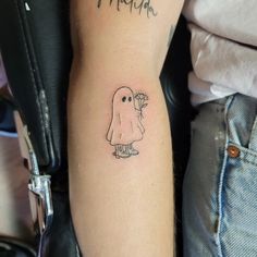 a person with a small tattoo on their arm