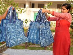 one of a kind Indigo bag .(Handmade kantha bag) Handmade kantha indigo bag dimensions are as follows length - 43 cm. length with handel- 64 cm. width - 38 cm. depth - 9 cm. Our vintage Kantha Stitch bags are a perfect combination of style and practicality. Each bag is made from upcycled vintage Indian saris then hand stitched in the homes of North Indian artisan women. Each piece, unique as the hands that lovingly stitched it, tells a story. No two piece are alike, this is the beauty of these pi Bohemian Rectangular Shopping Bag, Large Rectangular Hobo Bag For Daily Use, Bohemian Style Rectangular Canvas Shopping Bag, Bohemian Rectangular Canvas Shopping Bag, Bohemian Rectangular Hobo Bag For Shopping, Bohemian Shoulder Bag For Shopping, Bohemian Rectangular Canvas Bag For Daily Use, Bohemian Tote Bag For Shopping, Satchel Box Bag