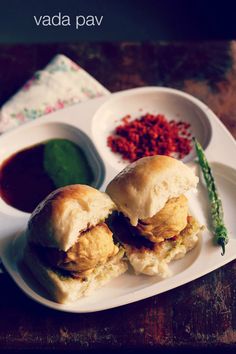 two sandwiches on a plate with dipping sauce