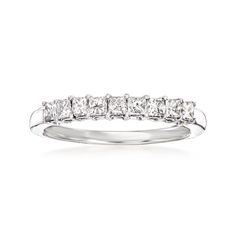 a white gold ring with five princess cut diamonds