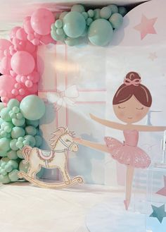 a ballerina girl in pink and green with balloons