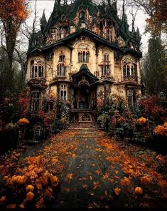 an old house is surrounded by trees and flowers in the fall time with leaves on the ground