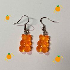 Super cute orange resin gummy bear earrings!! 🧸🧡  Nickel free earring hooks!  Charm size is about 0.7 inch/ 17 mm in length and 0.4 inch/ 10 mm in width Resin Gummy Bear, Gummy Bear Earrings, Orange Resin, Bear Earrings, Nickel Free Earrings, Gummy Bear, Earring Hooks, Gummy Bears, Jewelry Earrings Dangle