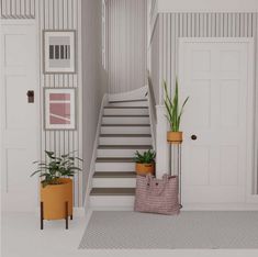 an entryway with stairs and potted plants