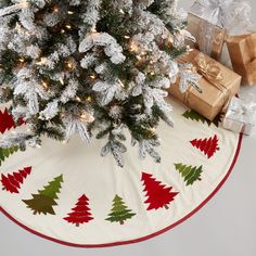 a christmas tree skirt with presents under it