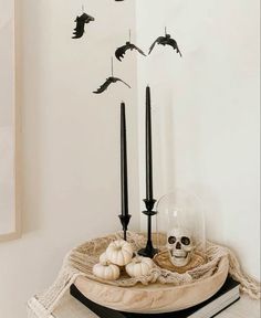 a table topped with candles and halloween decorations