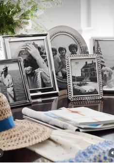 a table topped with pictures and hats on top of it