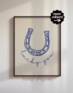 a drawing of a horseshoe hangs on the wall