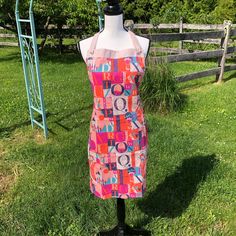 an apron on a mannequin in the grass