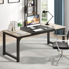 a computer desk with a monitor and keyboard on it in front of a bookshelf