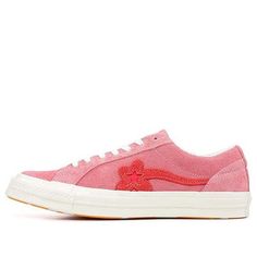 a pink tennis shoe with red hearts on the side and white soles, against a white background