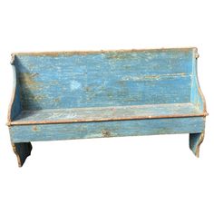 an old blue wooden bench sitting on top of a white background