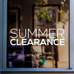 a window with the words summer clearance written on it