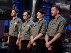 five men in uniform standing next to each other with their hands on their hipss