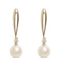 This pair of pearl drop earrings is elegant with diamond sparkle. Each earring features a 14K yellow gold loop that drops below the ear to a small round diamond atop a cultured freshwater pearl. These earrings have a post-push-back type closure. Formal Teardrop Pearl Earrings Fine Jewelry, Classic Diamond Drop Pearl Earrings, Elegant Yellow Gold Drop Diamond Earrings, Classic Dangle Diamond Pearl Earrings, Classic Dangle Pearl Earrings With Diamonds, Classic Pearl Dangle Earrings, Classic Pearl Earrings With Diamond, Classic Diamond Pearl Earrings With Elegant Design, Formal Drop Pearl Earrings In Fine Jewelry Style