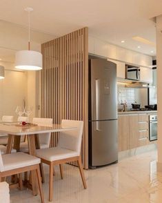 a kitchen and dining room with a refrigerator